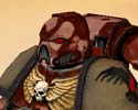 Camo patterned Space Marine in Blood Raven chapter colours